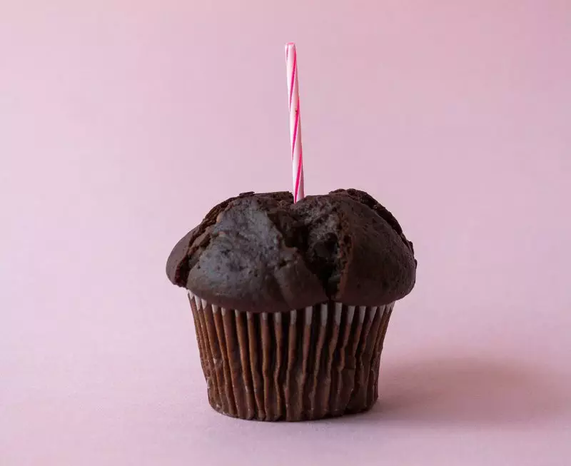 a cupcake with a straw